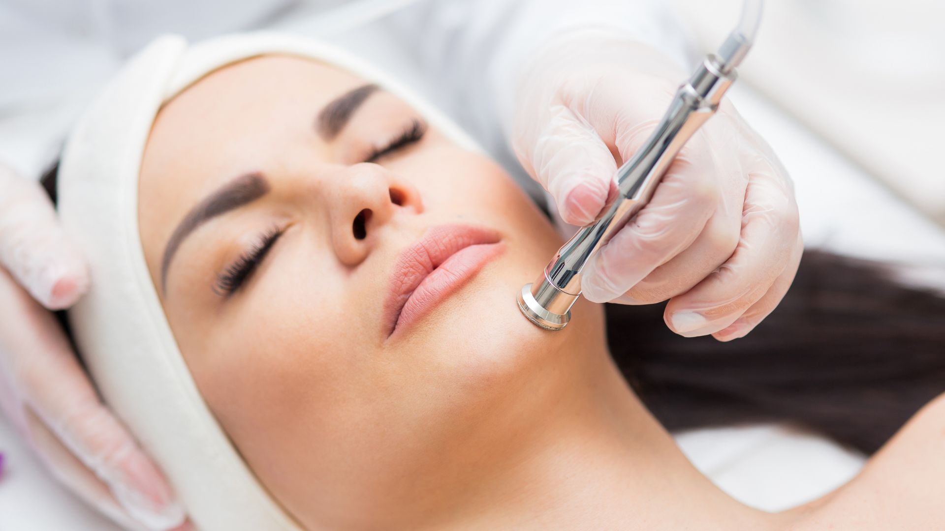 a woman getting a Microdermabrasion treatment for her face